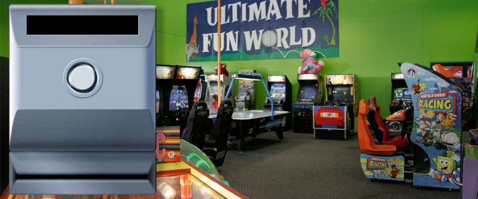 Photo of a cashless arcade payment system unit with an arcade in the background